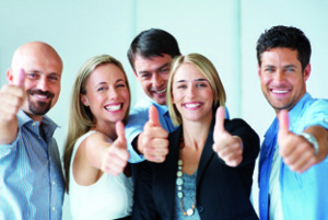 Business approval - Portrait of confident young colleagues with thumbs up sign